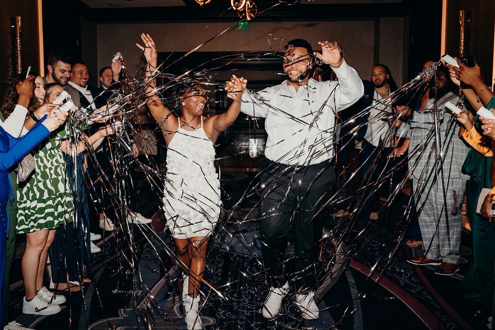 wedding reception exit with metallic streamers