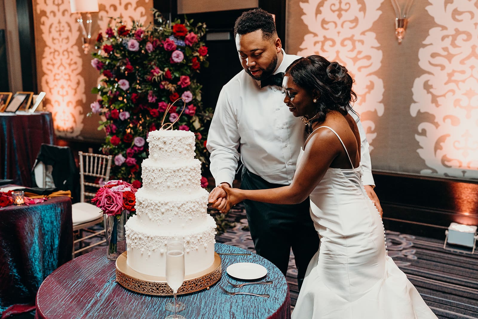 couple cutting the cake at their wedding