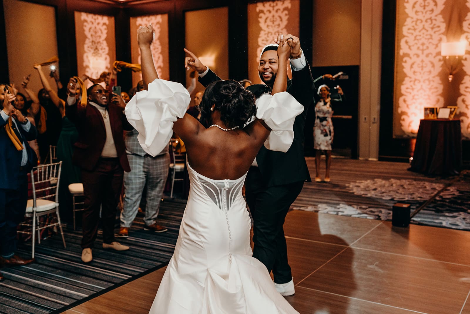 couple entering their wedding reception