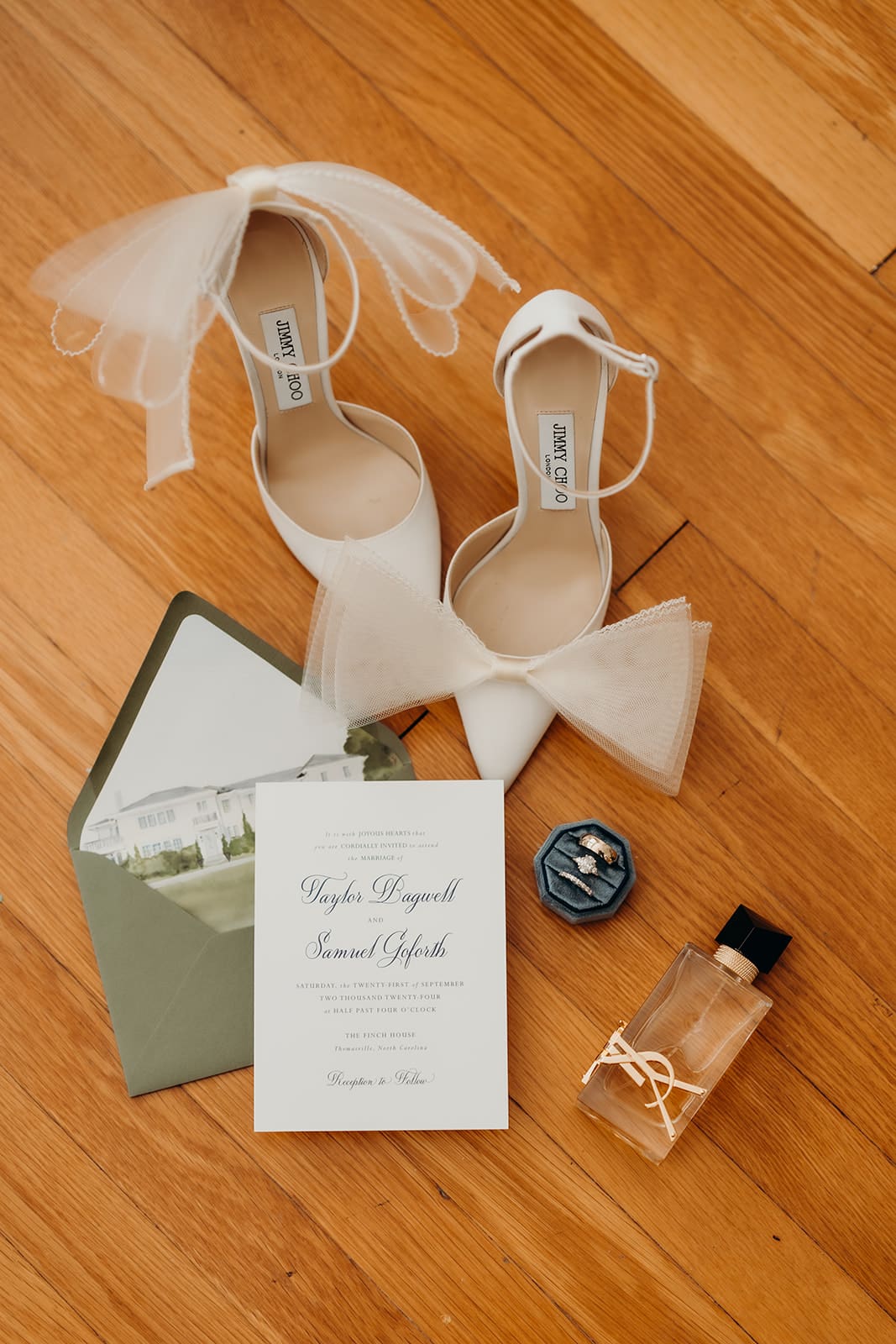 wedding detail photo including shoes, perfume, and invites