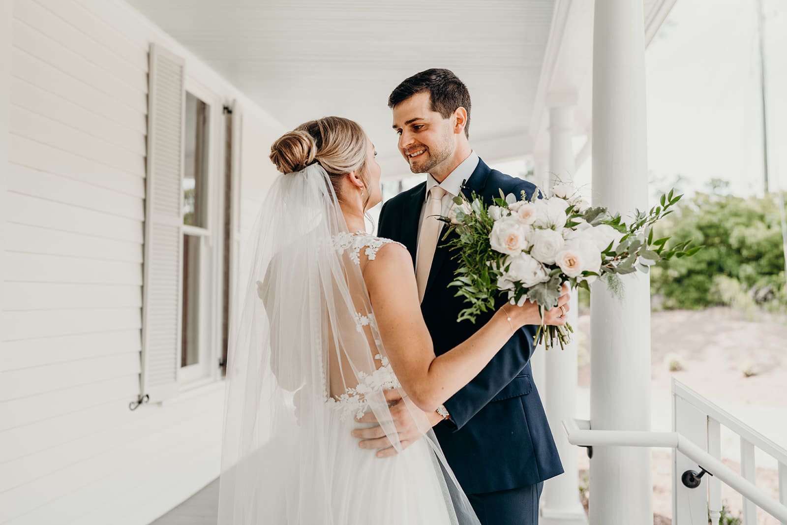 couple embracing on porch